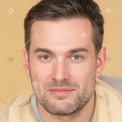 Joyful white adult male with short  brown hair and brown eyes