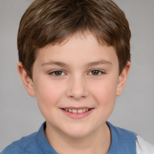 Joyful white child male with short  brown hair and brown eyes