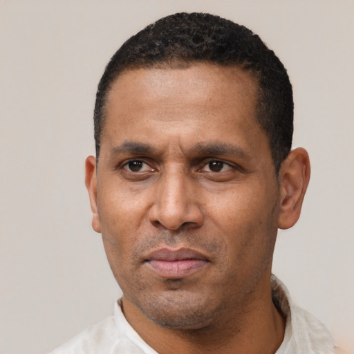 Neutral latino adult male with short  black hair and brown eyes