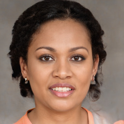 Joyful black young-adult female with medium  brown hair and brown eyes