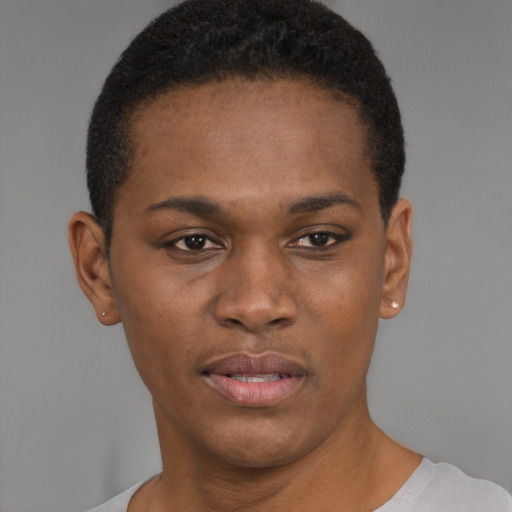 Joyful black young-adult female with short  brown hair and brown eyes