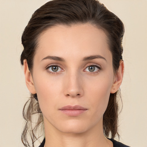 Neutral white young-adult female with medium  brown hair and brown eyes