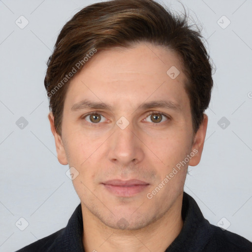 Joyful white adult male with short  brown hair and brown eyes