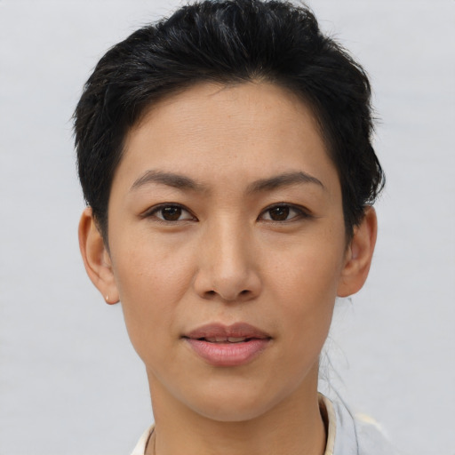 Joyful asian young-adult female with short  brown hair and brown eyes