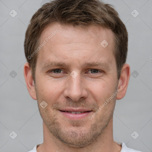 Joyful white adult male with short  brown hair and grey eyes