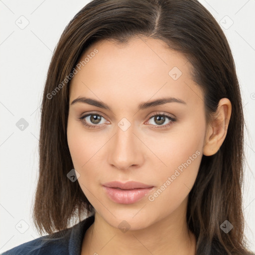 Neutral white young-adult female with long  brown hair and brown eyes