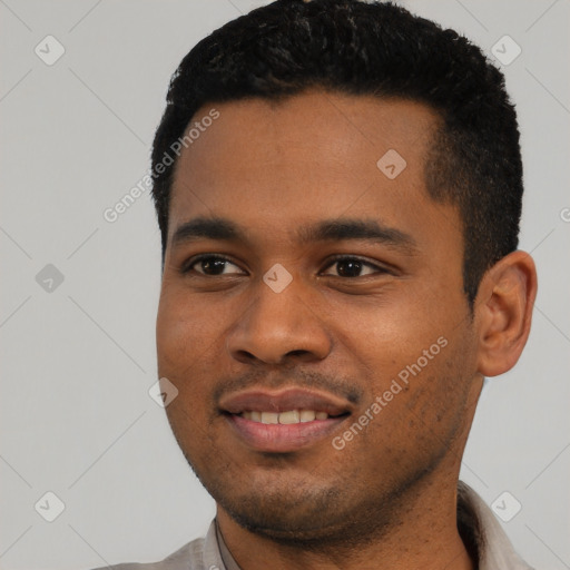 Joyful latino young-adult male with short  black hair and brown eyes