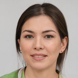 Joyful white young-adult female with medium  brown hair and brown eyes