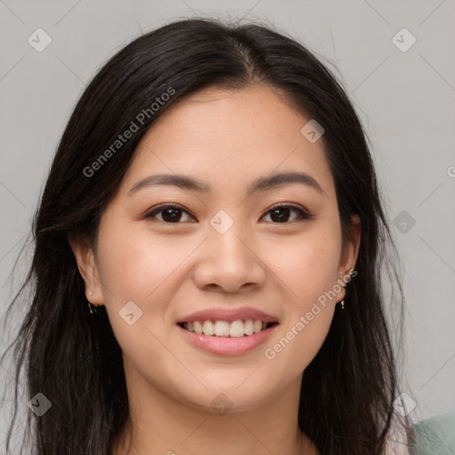 Joyful asian young-adult female with long  brown hair and brown eyes