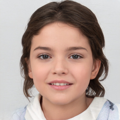 Joyful white child female with medium  brown hair and brown eyes