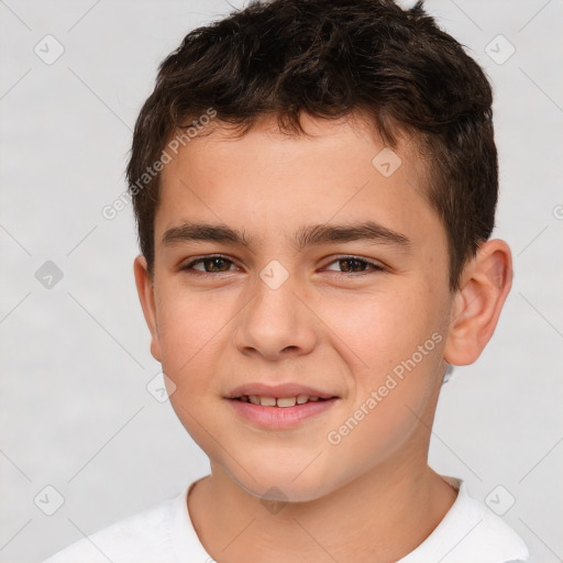 Joyful white child male with short  brown hair and brown eyes