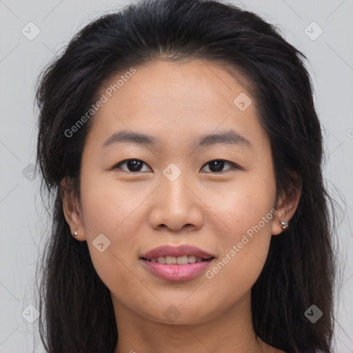 Joyful asian young-adult female with long  brown hair and brown eyes