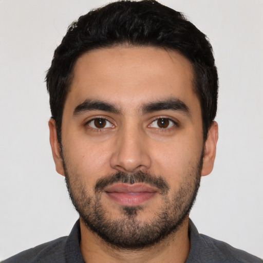 Neutral latino young-adult male with short  black hair and brown eyes