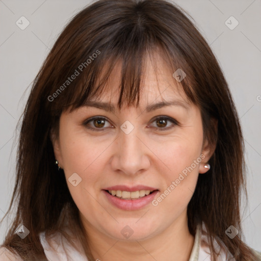 Joyful white adult female with medium  brown hair and brown eyes