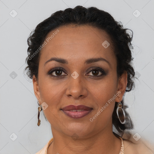 Joyful latino adult female with short  brown hair and brown eyes