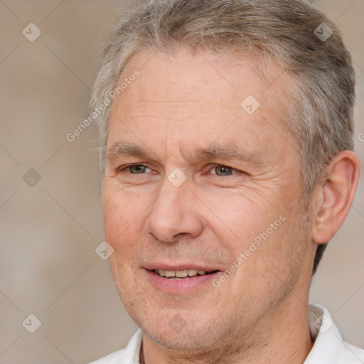 Joyful white middle-aged male with short  brown hair and brown eyes