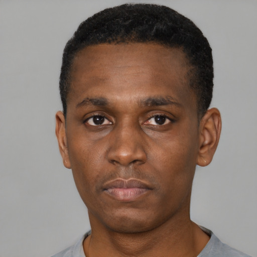 Neutral black young-adult male with short  black hair and brown eyes