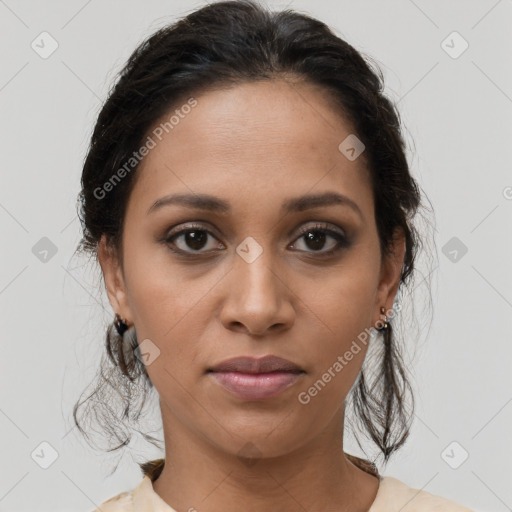 Joyful latino young-adult female with medium  brown hair and brown eyes