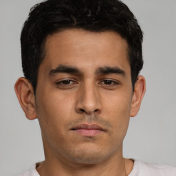 Neutral white young-adult male with short  black hair and brown eyes