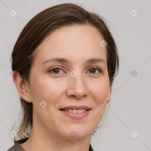 Joyful white adult female with medium  brown hair and grey eyes