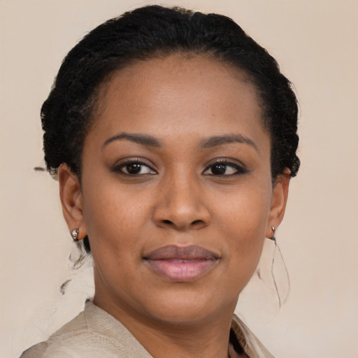 Joyful black young-adult female with short  brown hair and brown eyes