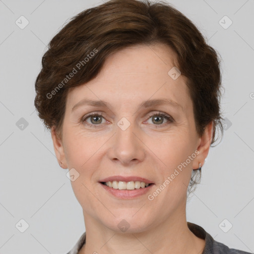 Joyful white adult female with short  brown hair and grey eyes