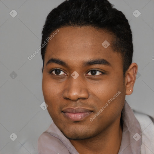Joyful black young-adult male with short  black hair and brown eyes