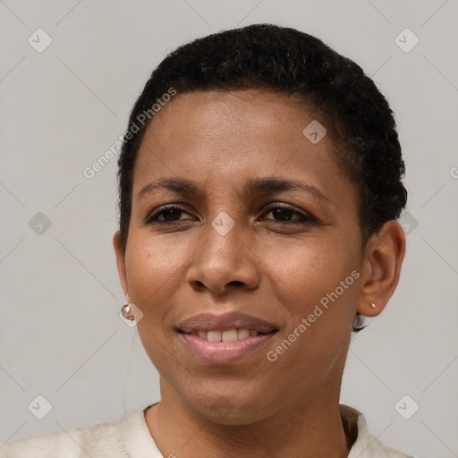 Joyful black young-adult female with short  brown hair and brown eyes