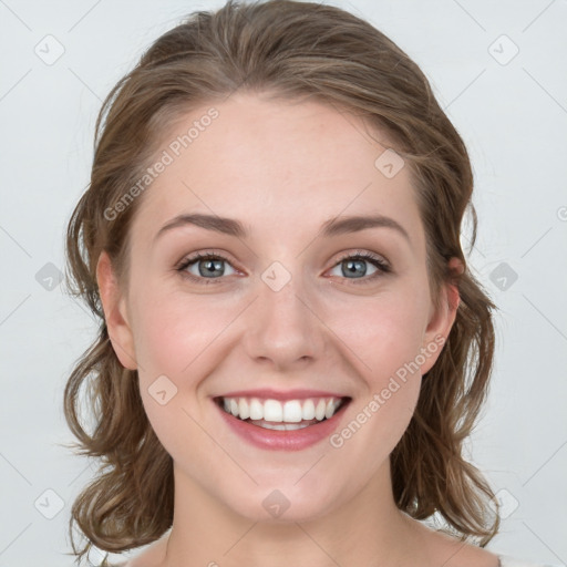 Joyful white young-adult female with medium  brown hair and blue eyes