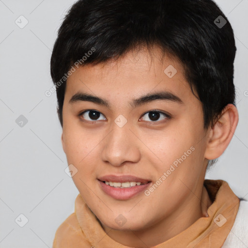 Joyful asian young-adult male with short  brown hair and brown eyes
