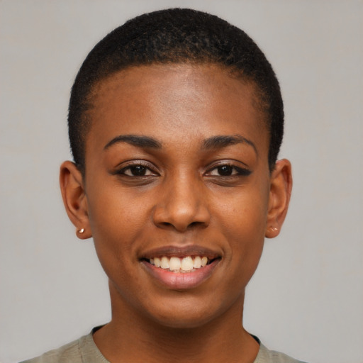Joyful black young-adult female with short  brown hair and brown eyes