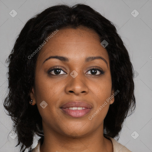 Joyful black young-adult female with long  brown hair and brown eyes