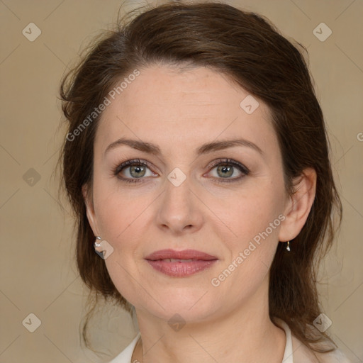 Joyful white young-adult female with medium  brown hair and green eyes