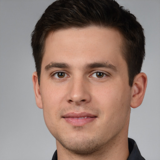 Joyful white young-adult male with short  brown hair and brown eyes