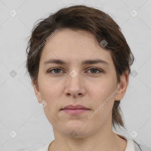 Neutral white young-adult female with short  brown hair and brown eyes