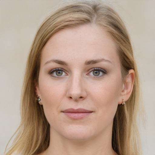 Joyful white young-adult female with long  brown hair and blue eyes