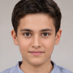 Joyful white child male with short  brown hair and brown eyes