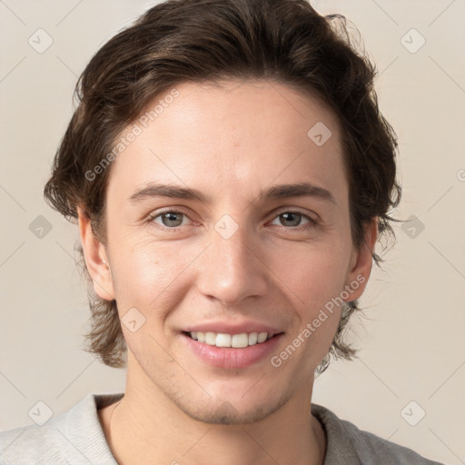 Joyful white young-adult female with short  brown hair and grey eyes