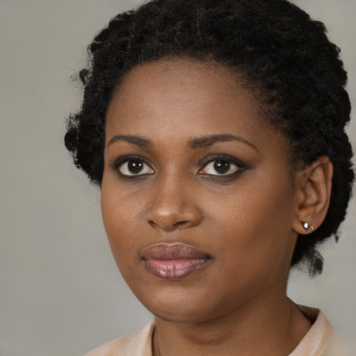 Neutral black young-adult female with medium  brown hair and brown eyes