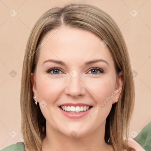 Joyful white young-adult female with long  brown hair and green eyes