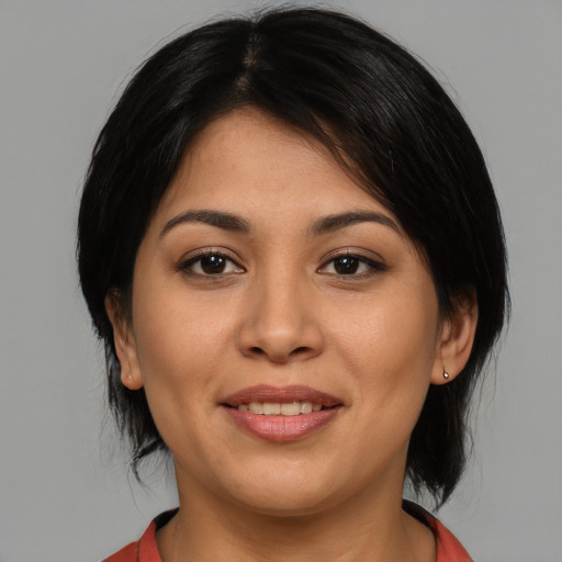 Joyful asian young-adult female with medium  black hair and brown eyes
