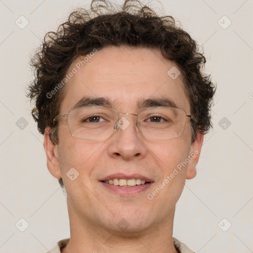 Joyful white adult male with short  brown hair and brown eyes