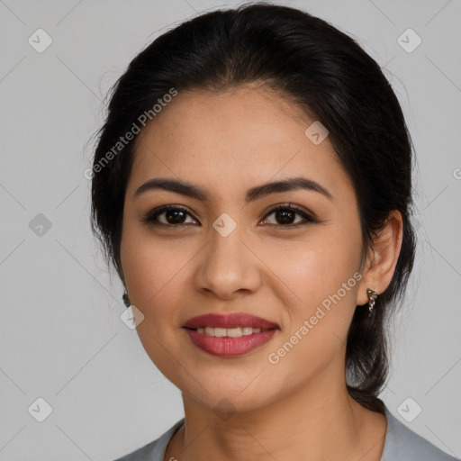 Joyful latino young-adult female with medium  brown hair and brown eyes