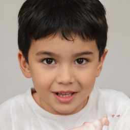 Joyful white child male with short  brown hair and brown eyes