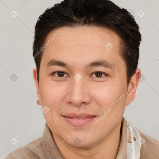 Joyful white adult male with short  brown hair and brown eyes