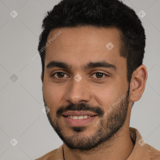 Joyful white young-adult male with short  black hair and brown eyes