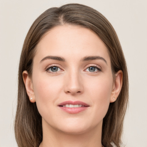 Joyful white young-adult female with long  brown hair and grey eyes