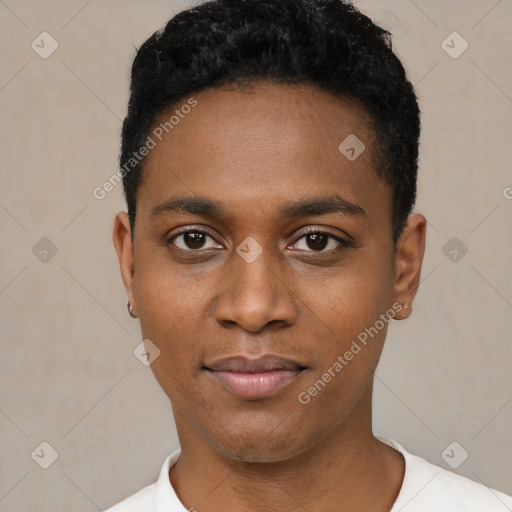 Joyful black young-adult male with short  black hair and brown eyes