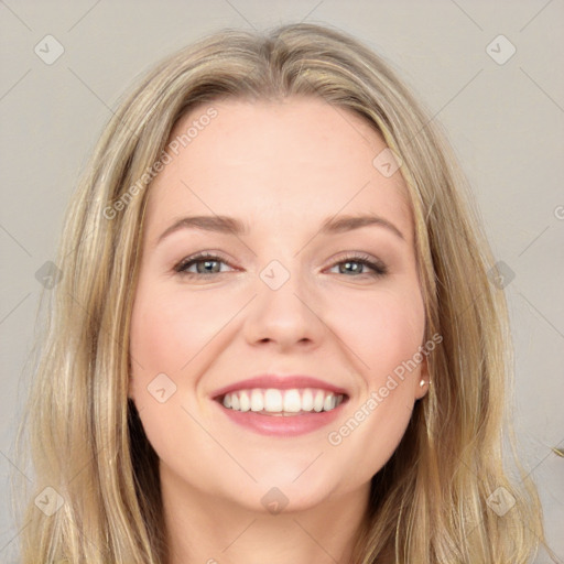 Joyful white young-adult female with long  brown hair and blue eyes