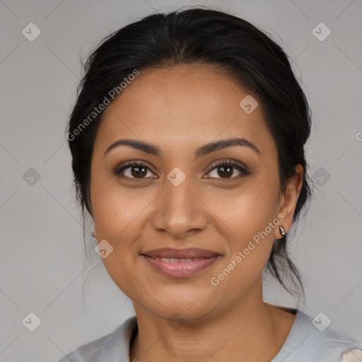 Joyful latino young-adult female with medium  brown hair and brown eyes